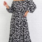 viskózové šaty v plus size veľkosti s motívom bielych lístkov na čiernom podklade, s vysokým rozparkom na sukni a elastickým výstrihom
